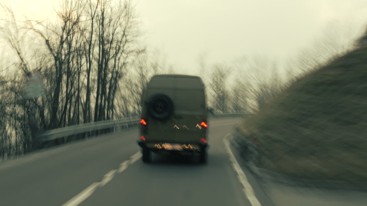 Van driving on a winding mountain road