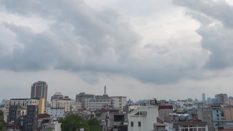 Timelapse-of-clouds-at-sunset-over-the-rooftops-of-downtown-Saigon,-Vietnam