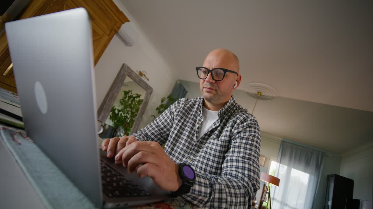 Man Working From Home on Laptop