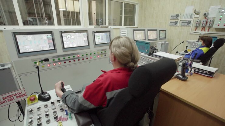 Industrial Control Room with Operators