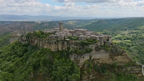 Aerial-over-the-hilltop-village-of-Civita-di-Bagnoregio,-Province-of-Viterbo,-Italy