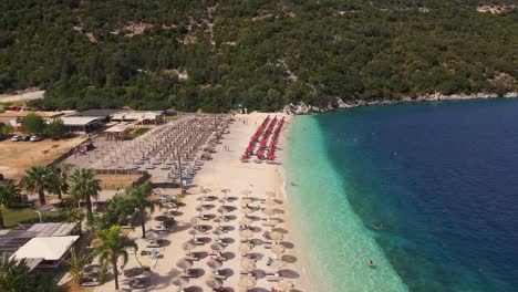 flying over beach chairs on myrtos beach in greece