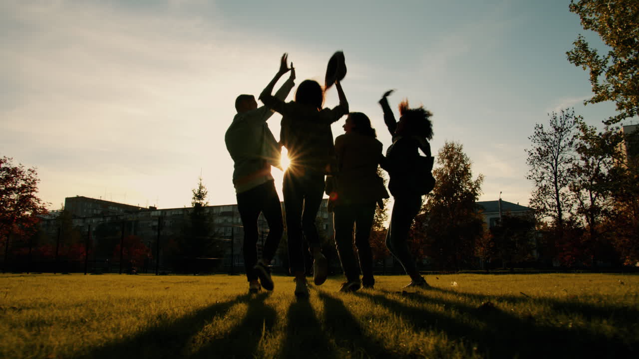 Friends Dancing at Sunset in the Park