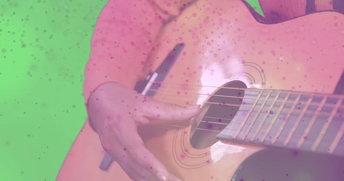 Artist's fingers hovering then plucking and strumming guitar strings speckle overlay for music demo