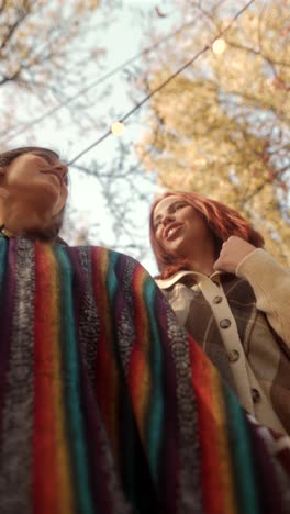 two friends enjoying an outdoor gathering