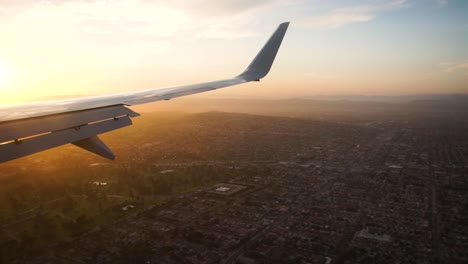 A-view-from-a-plane-window-while-flying-over-Los-Angeles,-CA