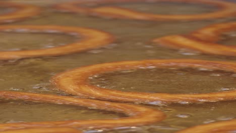 fried heart-shaped turkish treats in hot oil