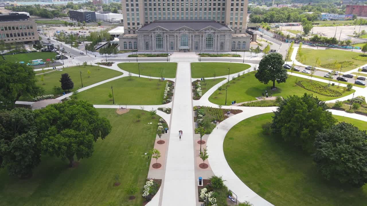 Modernized historic Central Station in Corktown neighborhood of Detroit, aerial drone tilt up view