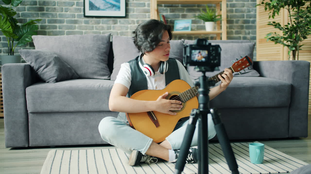 Teenager Playing Guitar in Living Room