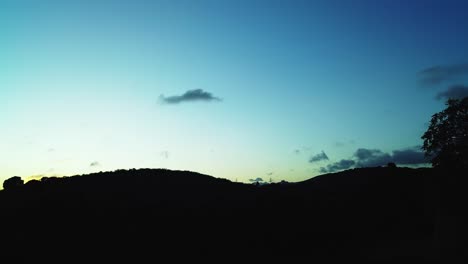 time lapse of sunset over a countryside hill