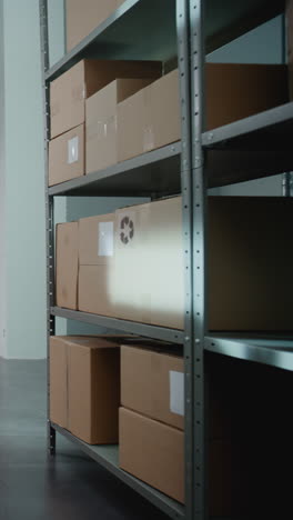 warehouse storage shelves with cardboard boxes