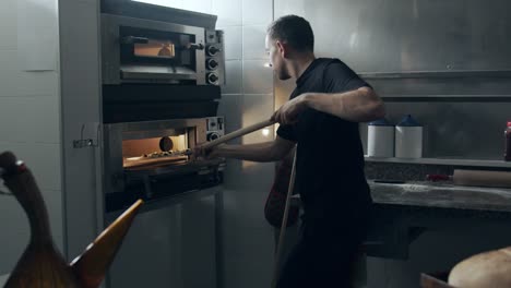 Raw-pizza-on-shovel-before-baking