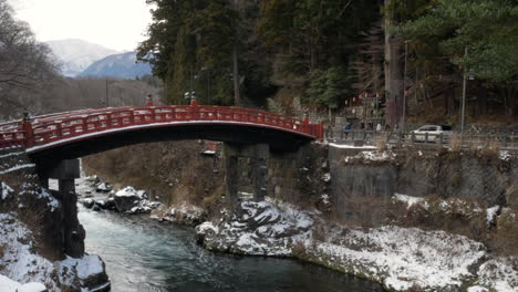 slow panning hyperlapse of the snow covered shinkyo bridge, nikko, tochigi, japan.