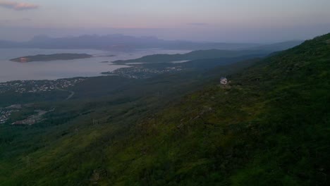 stunning aerial view of a coastal mountain landscape in norway at sunset