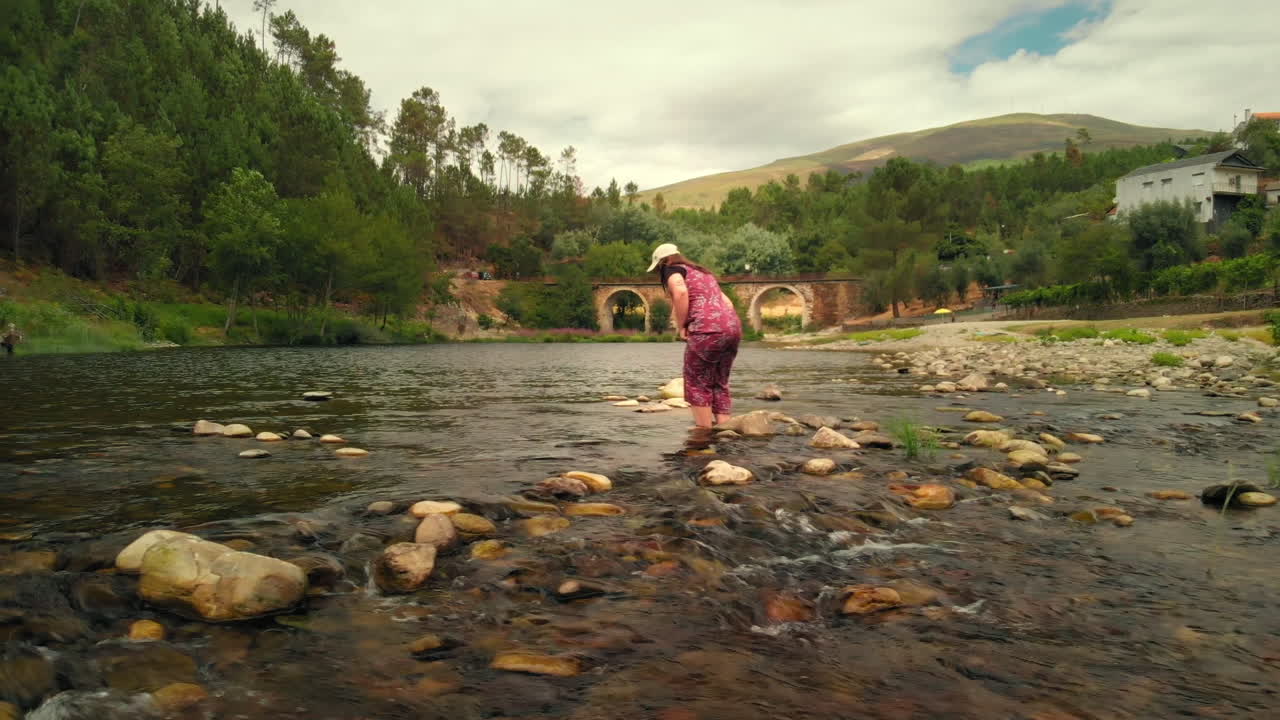 Girl in the River in a Summer Day