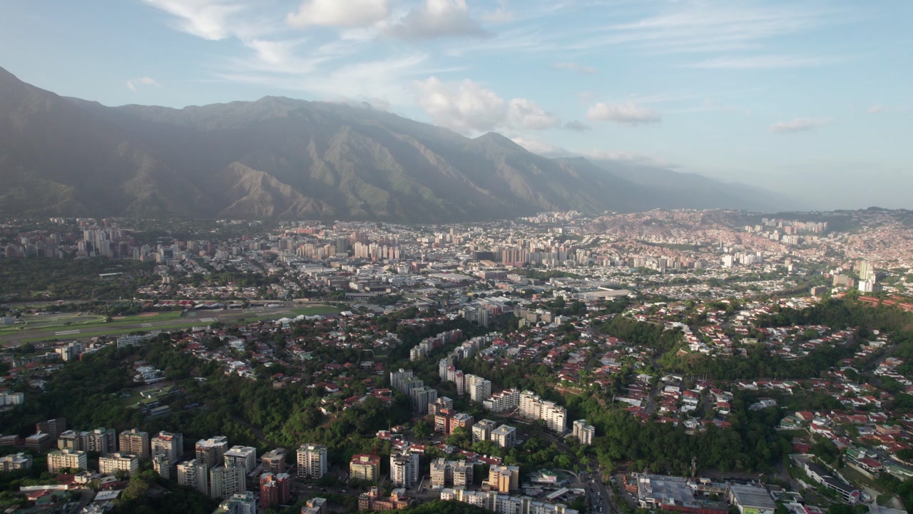 Static drone over Macaracuay, Caracas showing rooftops, homes, and street grid