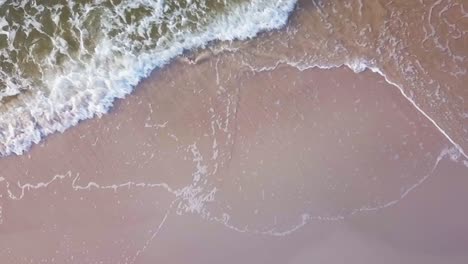 aerial view of sea waves on sandy beach of baltic sea