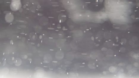 Bokeh-De-Fondo-Abstracto-Gris-Y-Blanco-Con-Luces-Flotantes-Efecto-Nieve