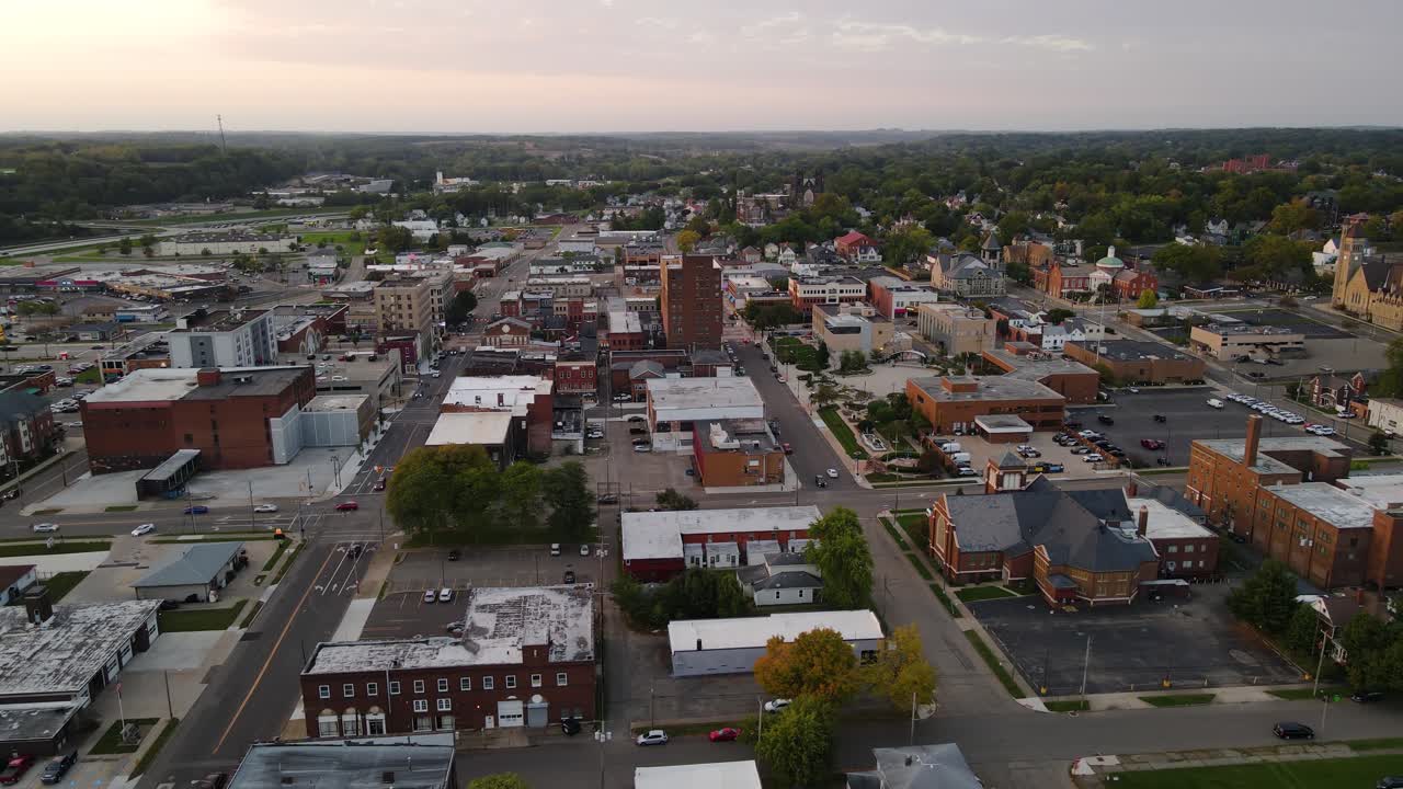 Aerial view of downtown Massillon, Ohio at sunset featuring historic buildings and streets. Crane Up Right Sunset N