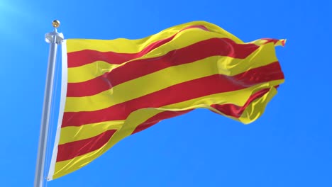 catalonia flag waving at wind in blue sky, loop