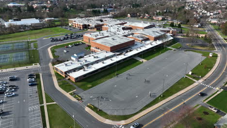 American-school-building-aerial-orbit-of-exterior