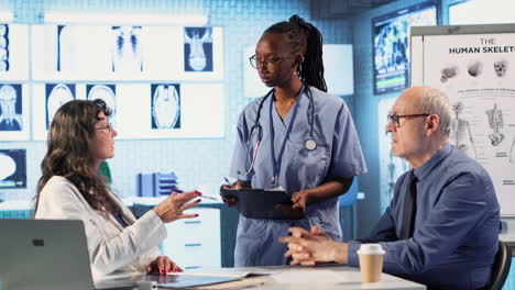 medic and african american nurse offer support to old man during checkup
