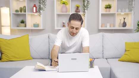 Woman-bringing-coffee-to-her-home-office-worker-husband-at-home.