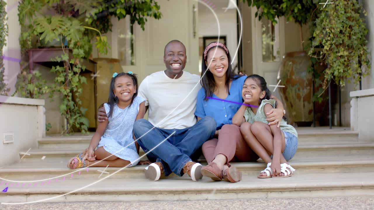 Dad placing arms around kids, streaks passing over family, smiling on stoop for marketing