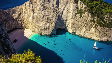 High-angle-shot-over-ferry-boats-in-the-turquoise-lagoon-surrounding-the-iconic-Shipwreck-Beach,-Zakynthos,-Greek-Islands,-Greece,-Europe