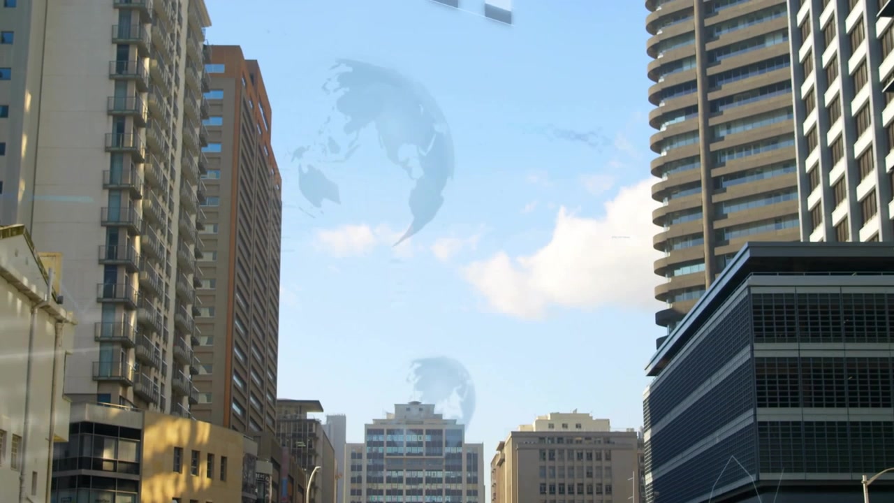 Grattacieli del centro che mostrano una sovrapposizione che emerge da sinistra, con globi animati che si espandono nel cielo sereno.