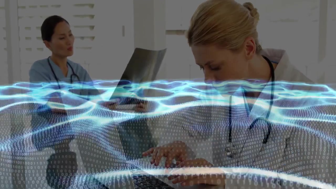 Doctors typing laptop and holding radiograph in clinical office, showing health data overlay