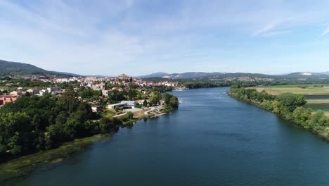 a beautiful valley with a river blue sky