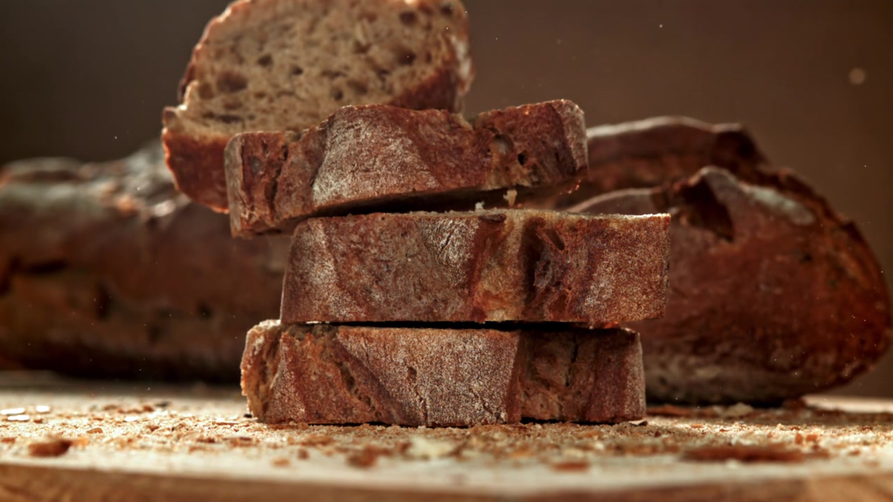 Freshly Baked Bread Slices Falling and Stacking in Slow Motion