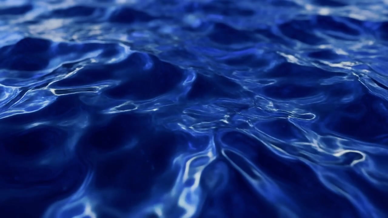 Primo Piano di Onde Oceaniche Blu Intenso che si Increspano