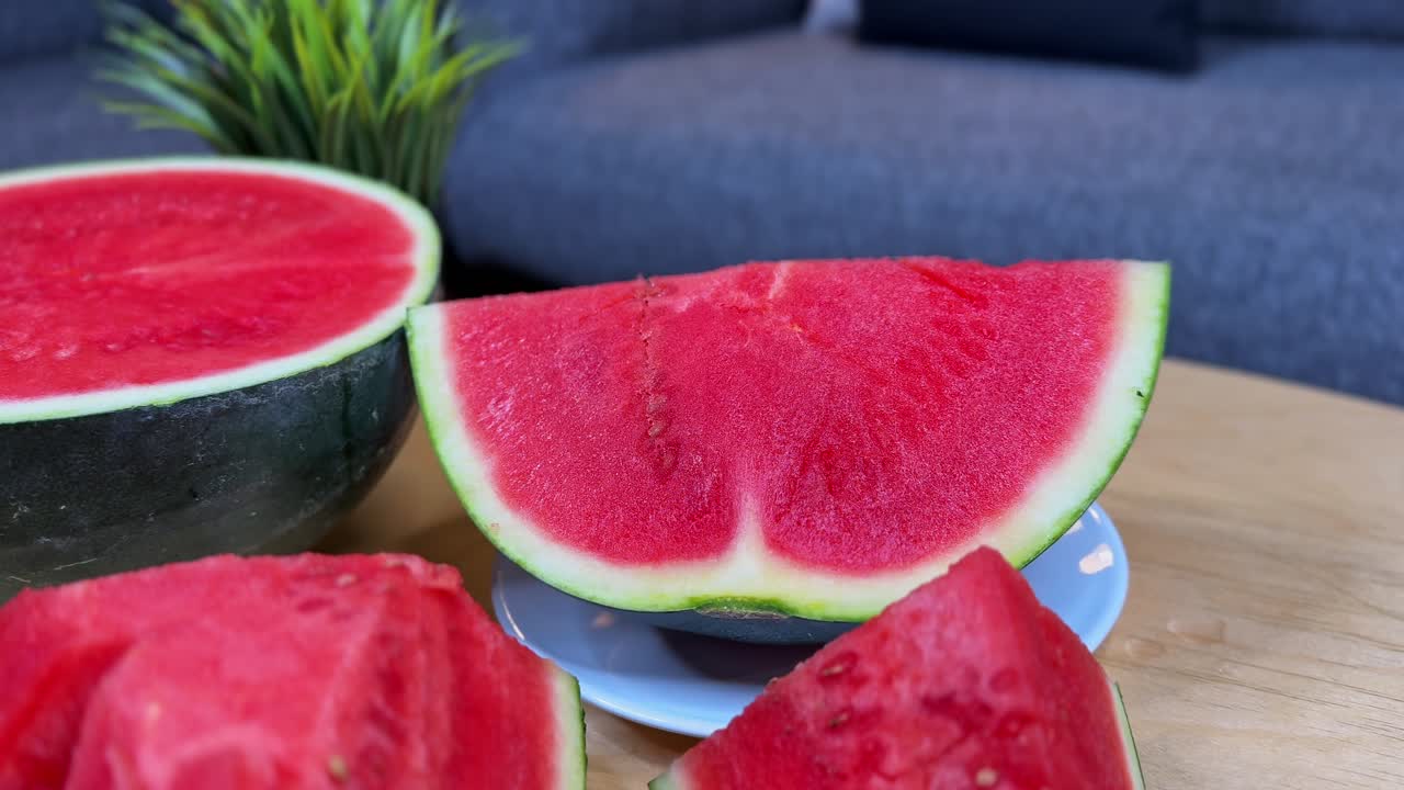 Close-up of a juicy red watermelon slice on a plate. Bright, fresh, and healthy fruit perfect for summer ads, lifestyle promos, nutrition content, and wellness branding