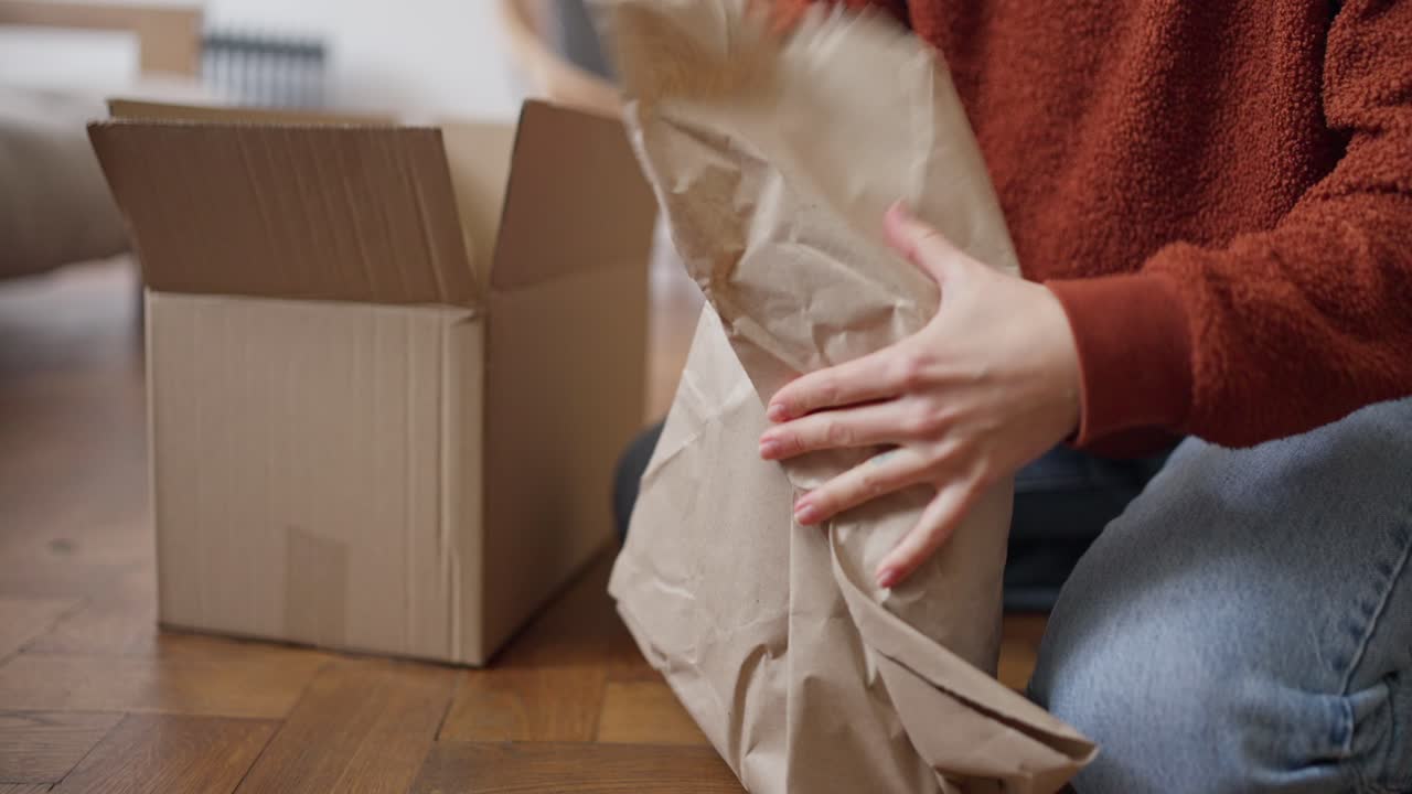 Woman Unpacking Boxes During a Move