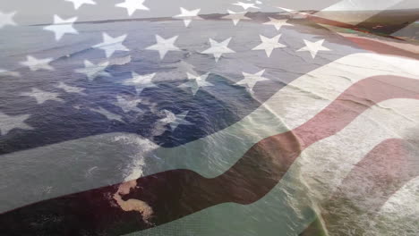 digital composition of waving us flag against aerial view of waves in the sea