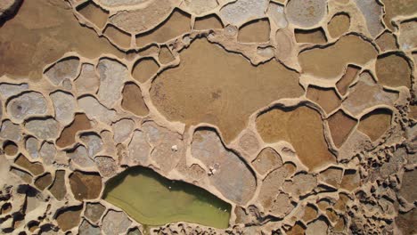 aerial overhead of salt pans of xwejni on gozo island, malta