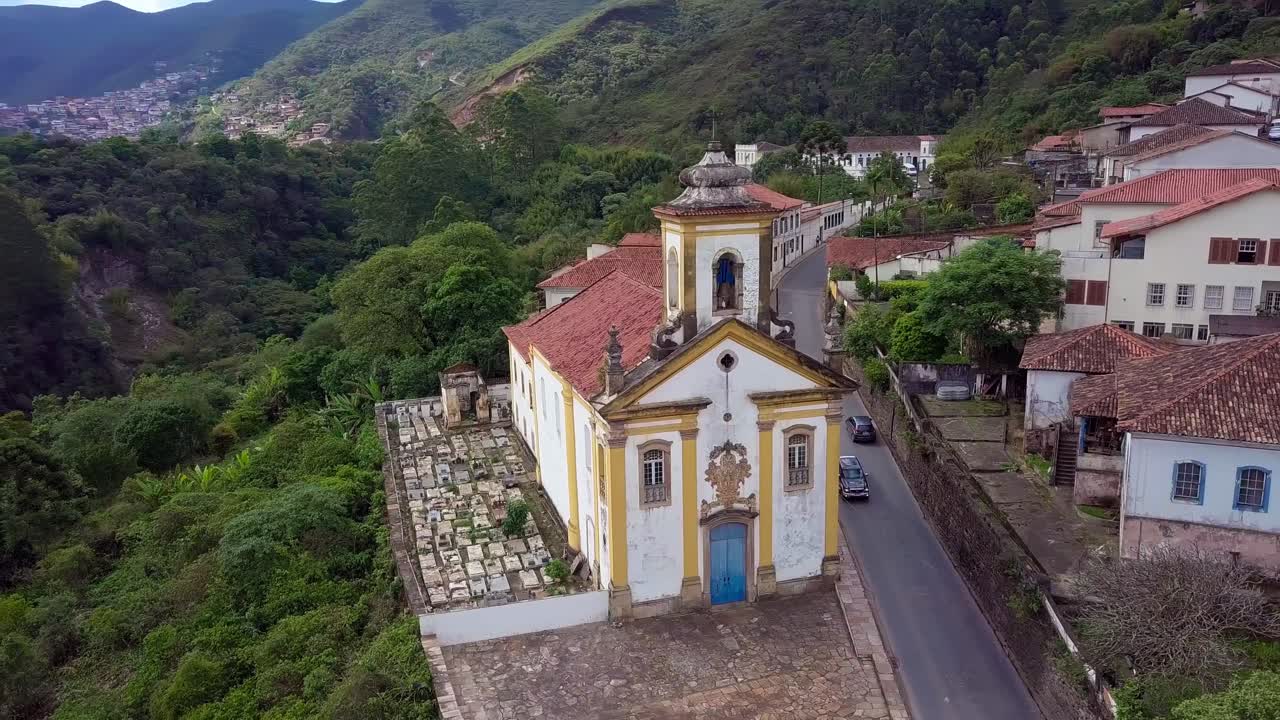 Historic mountain church and scenic colonial town, aerial perspective with calm vibe