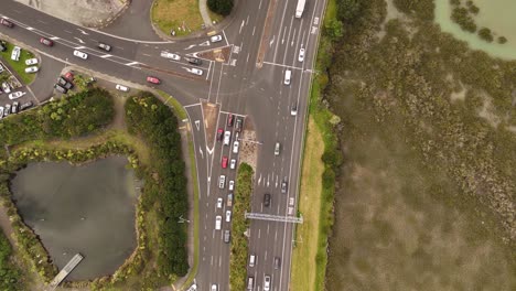 top down view of city traffic by highway in takapuna area, auckland city, new zealand