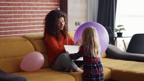 Busy-mother-working-on-laptop,-lack-of-attention-to-child-ask-her-to-play