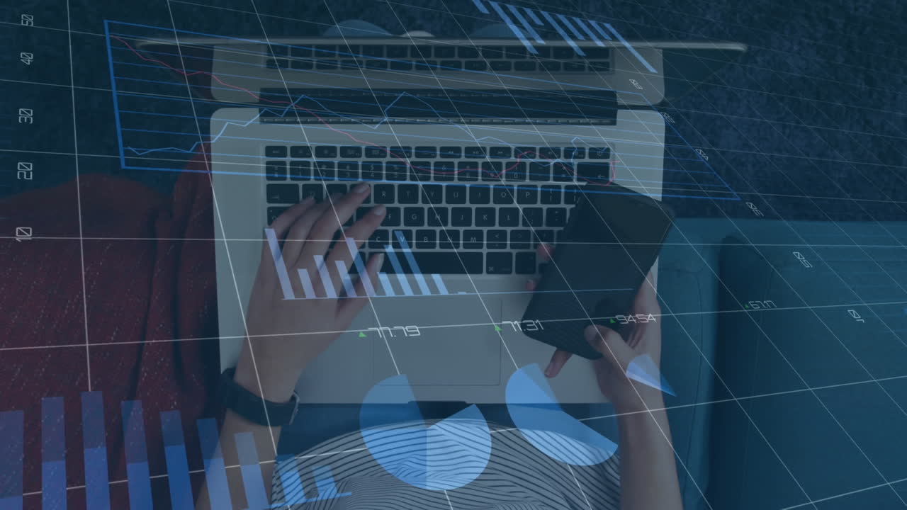 Animation of graphs, changing numbers, overhead view of caucasian woman using cellphone and laptop