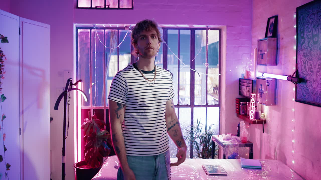 Portrait of a man with tattoos in a studio