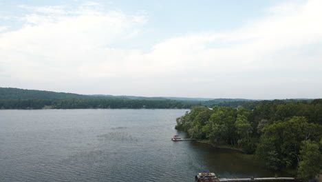 aerial pedestal above private docks on lake shore on cloudy day