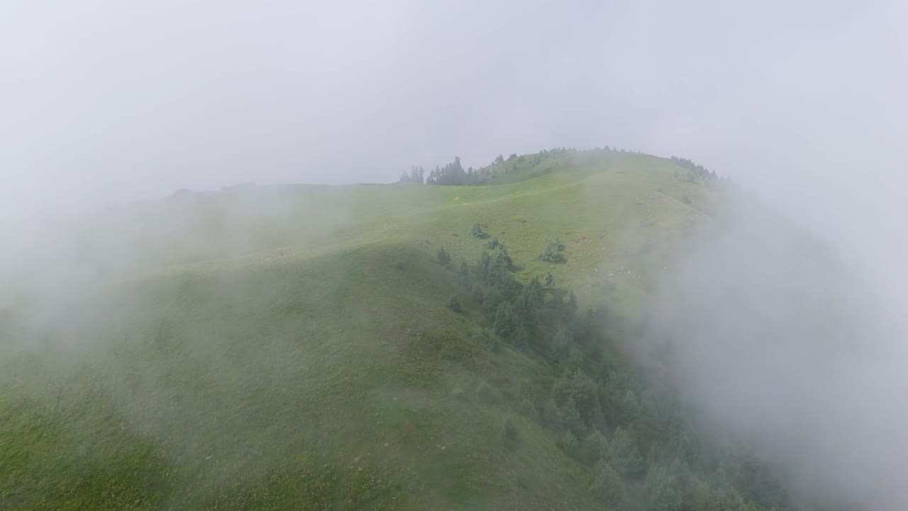 A Serene Drone Experience of Flying High Over Kuna Dana Peak with Clouds