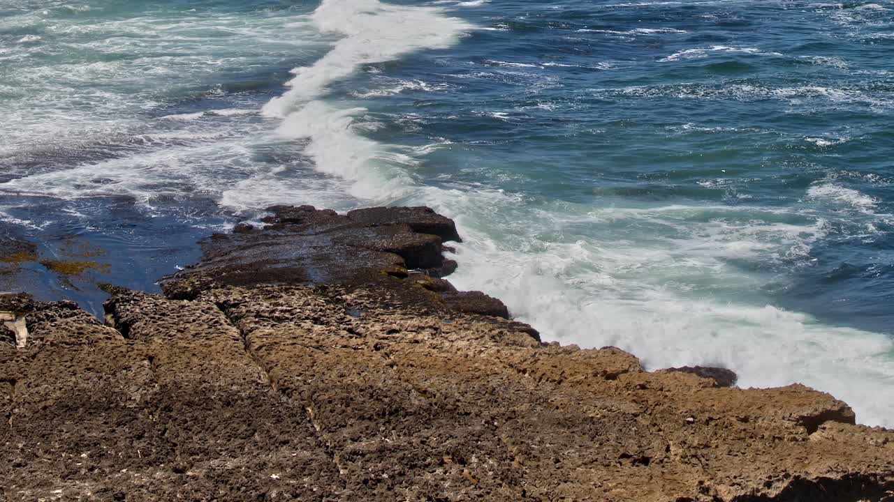 Coastline with rocky formations and waves in Portugal