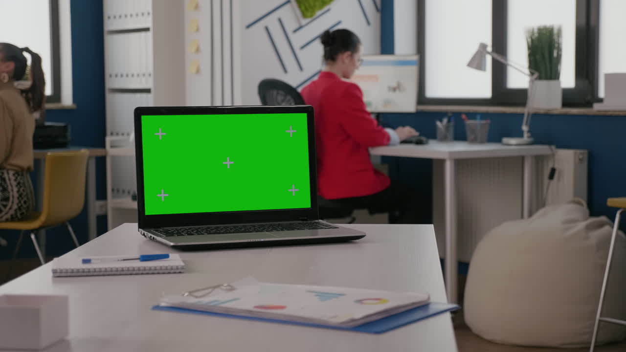 Close up of green screen on laptop in business office