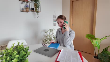 a woman sitting at a desk indoors