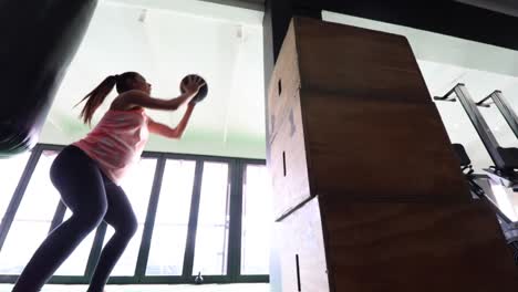 pregnant female fitness model doing body weight exercise in a gym to keep fit during her third trimester of pregnancy-2