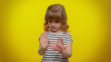 Kid-child-girl-warning-with-admonishing-finger-gesture-sign,-saying-no,-be-careful,-avoid-danger